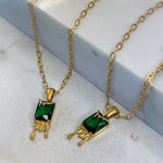 Mila honey drip necklace with deep green crystal on marble, 18K gold-plated pendant, earthy style jewelry by Avyrona.