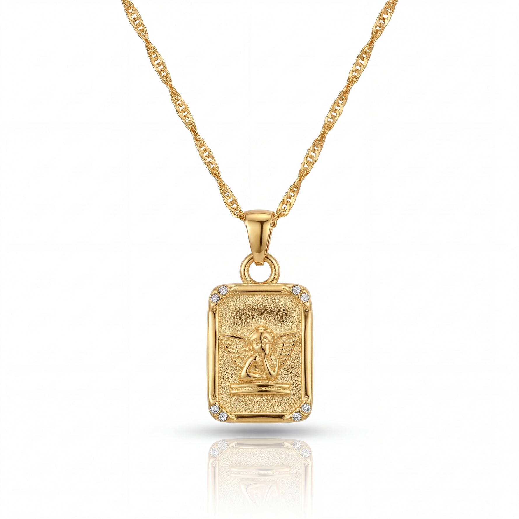 Gold pendant necklace with a detailed design on a white background