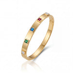 Gold bracelet with colorful gemstones on a white background