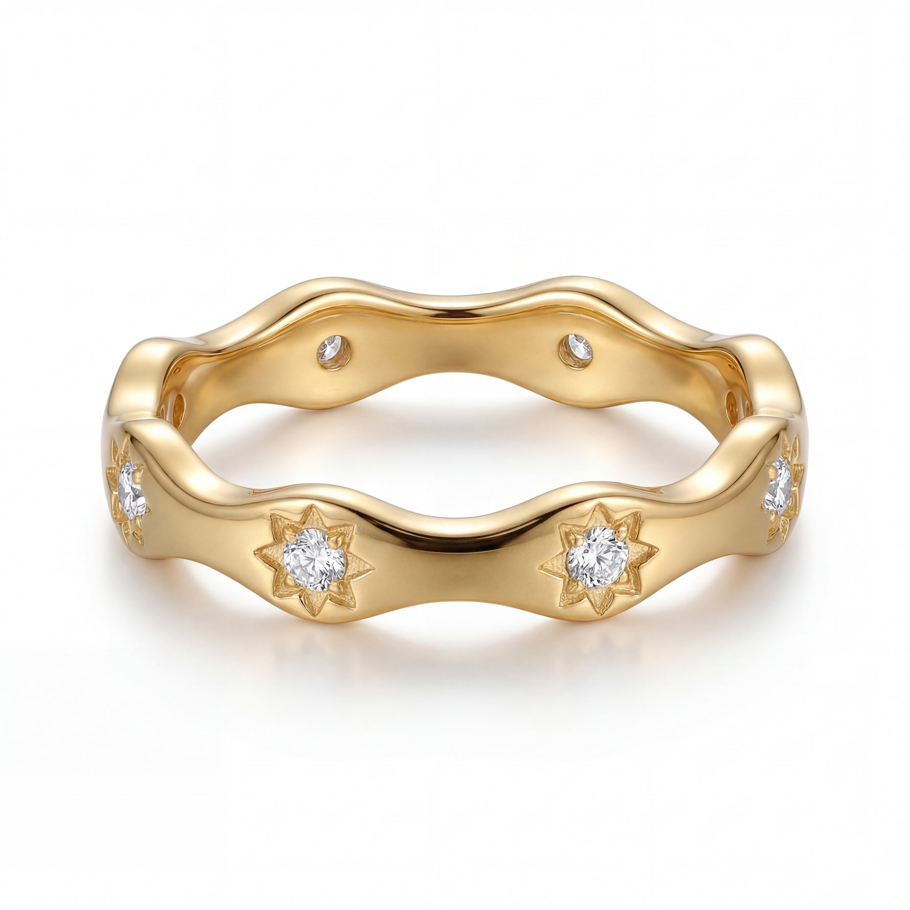 Gold ring with diamond accents on a white background