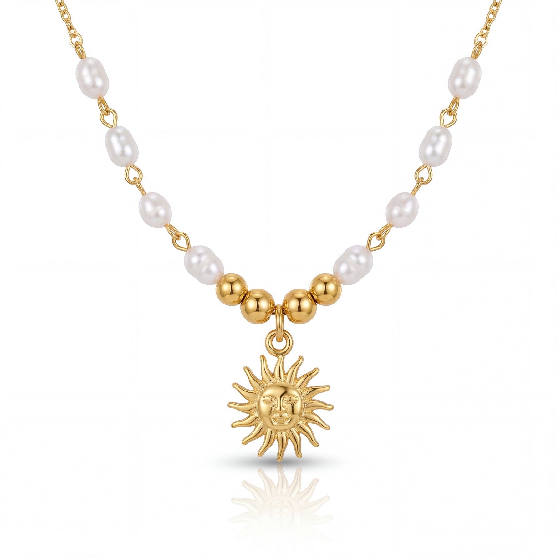 Necklace with gold sun pendant and pearl beads on a white background