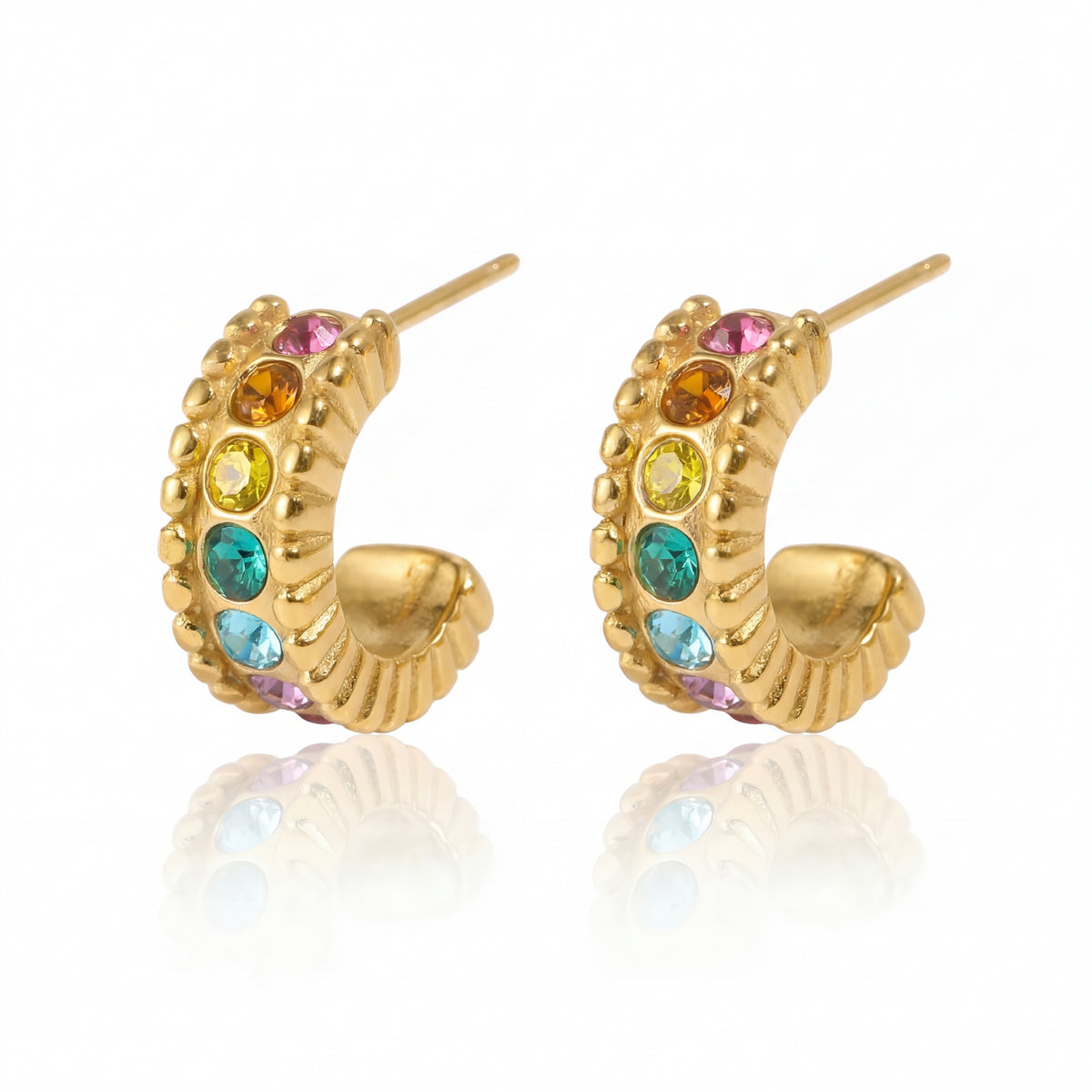 Gold hoop earrings with colorful gemstones on a white background