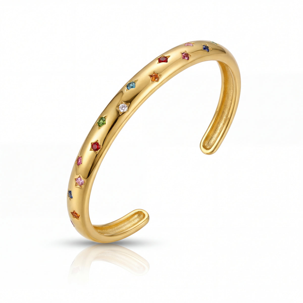 Gold ring with colorful gemstones on a white background