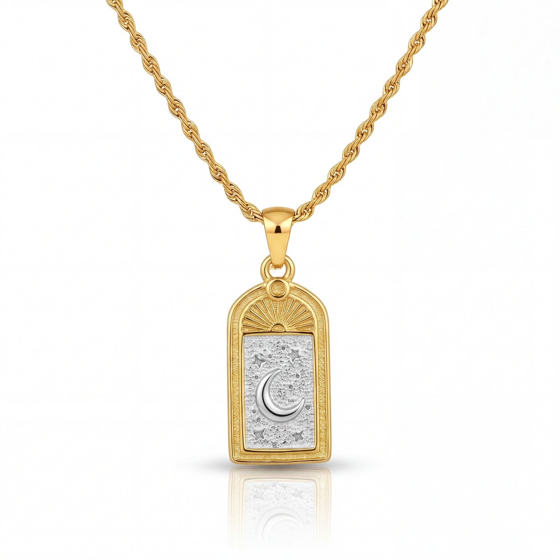 Gold necklace with a pendant featuring a moon design on a white background