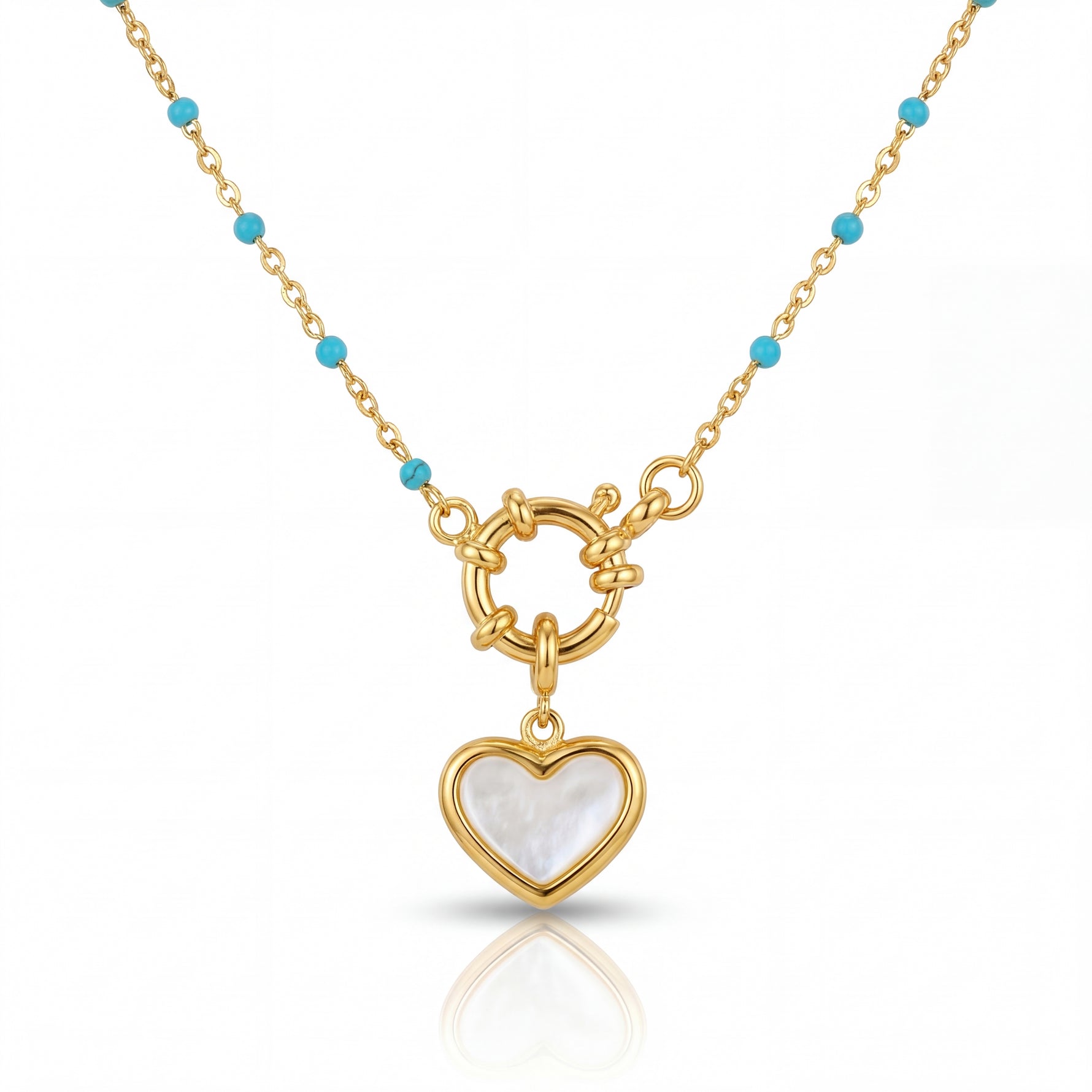 Gold necklace with a heart-shaped pendant on a white background