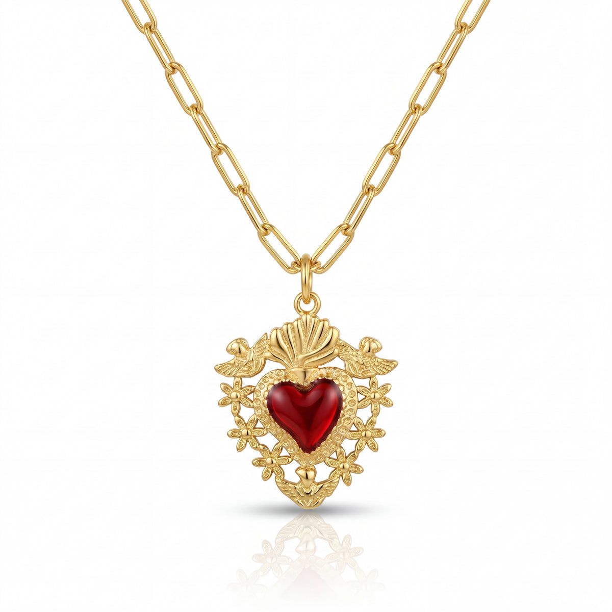 Gold necklace with a red heart pendant on a white background