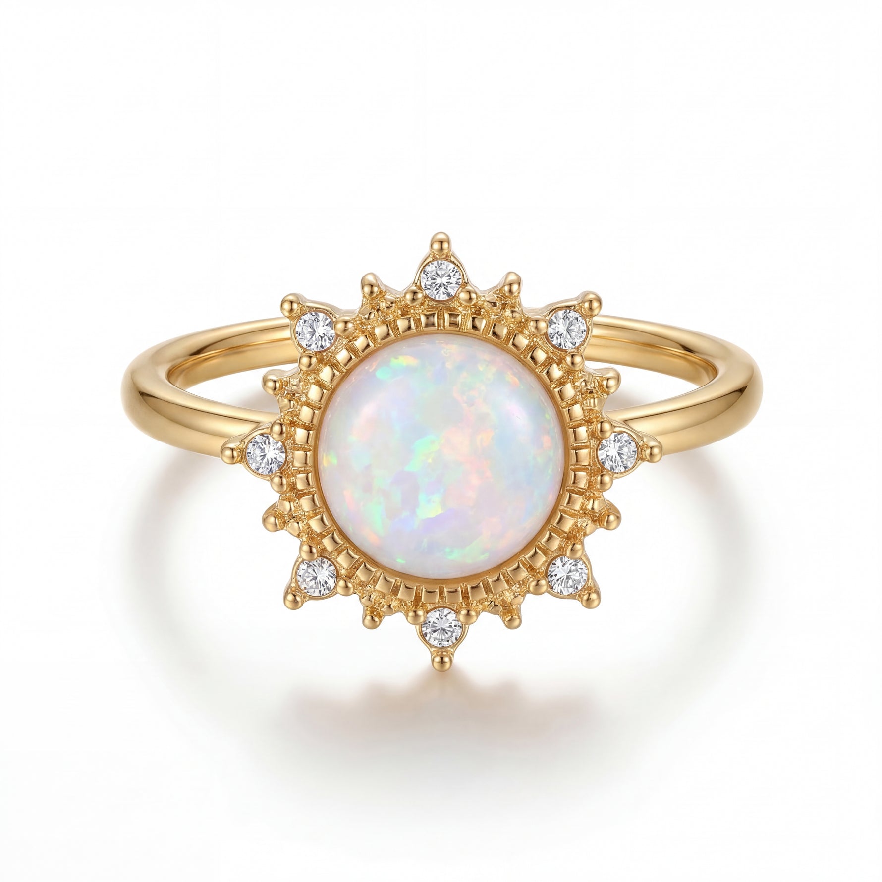 Gold ring with a central opal stone and diamond accents on a white background