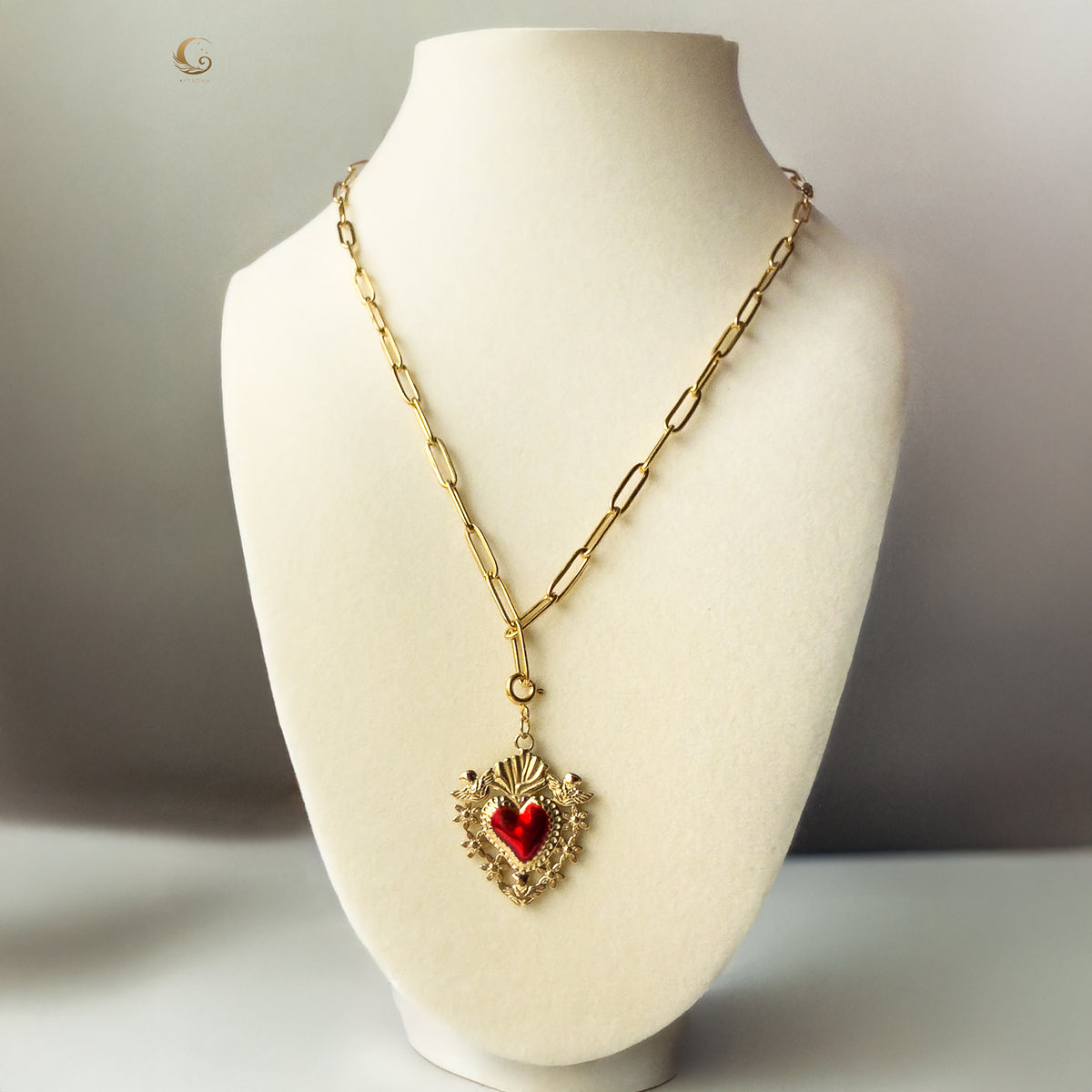 Amara Sacred Heart necklace styled on white bust, showing full length and statement pendant.