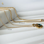 Two necklace chain options, A-Link and B-Twisted, displayed with the emerald heart pendant