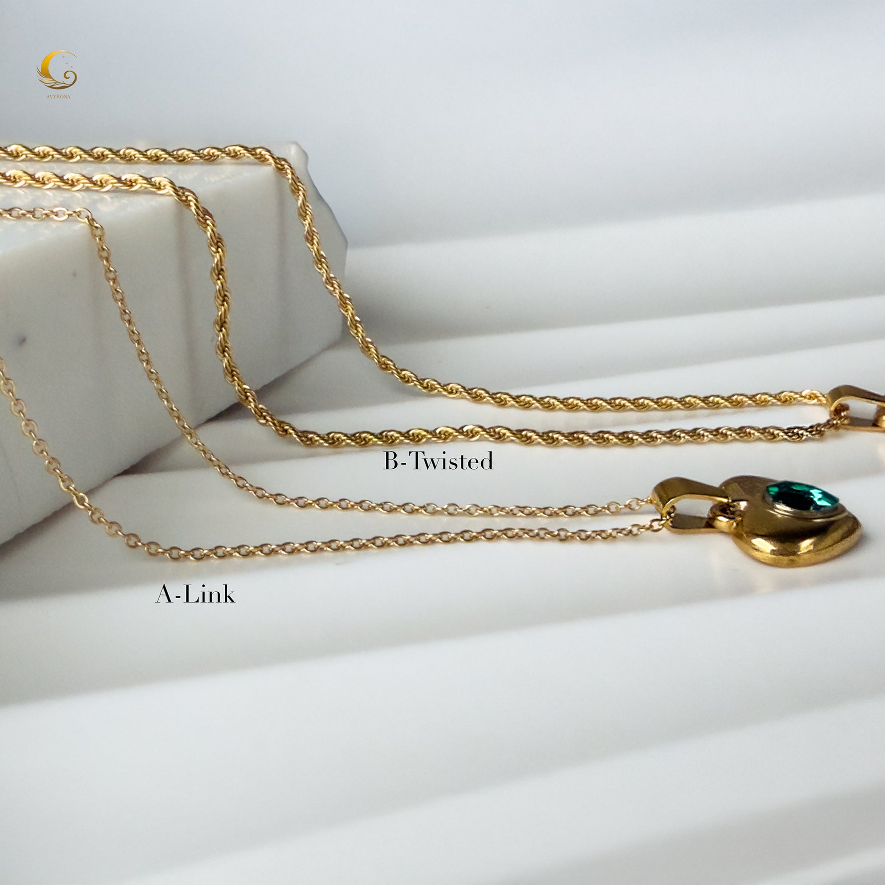 Two necklace chain options, A-Link and B-Twisted, displayed with the emerald heart pendant
