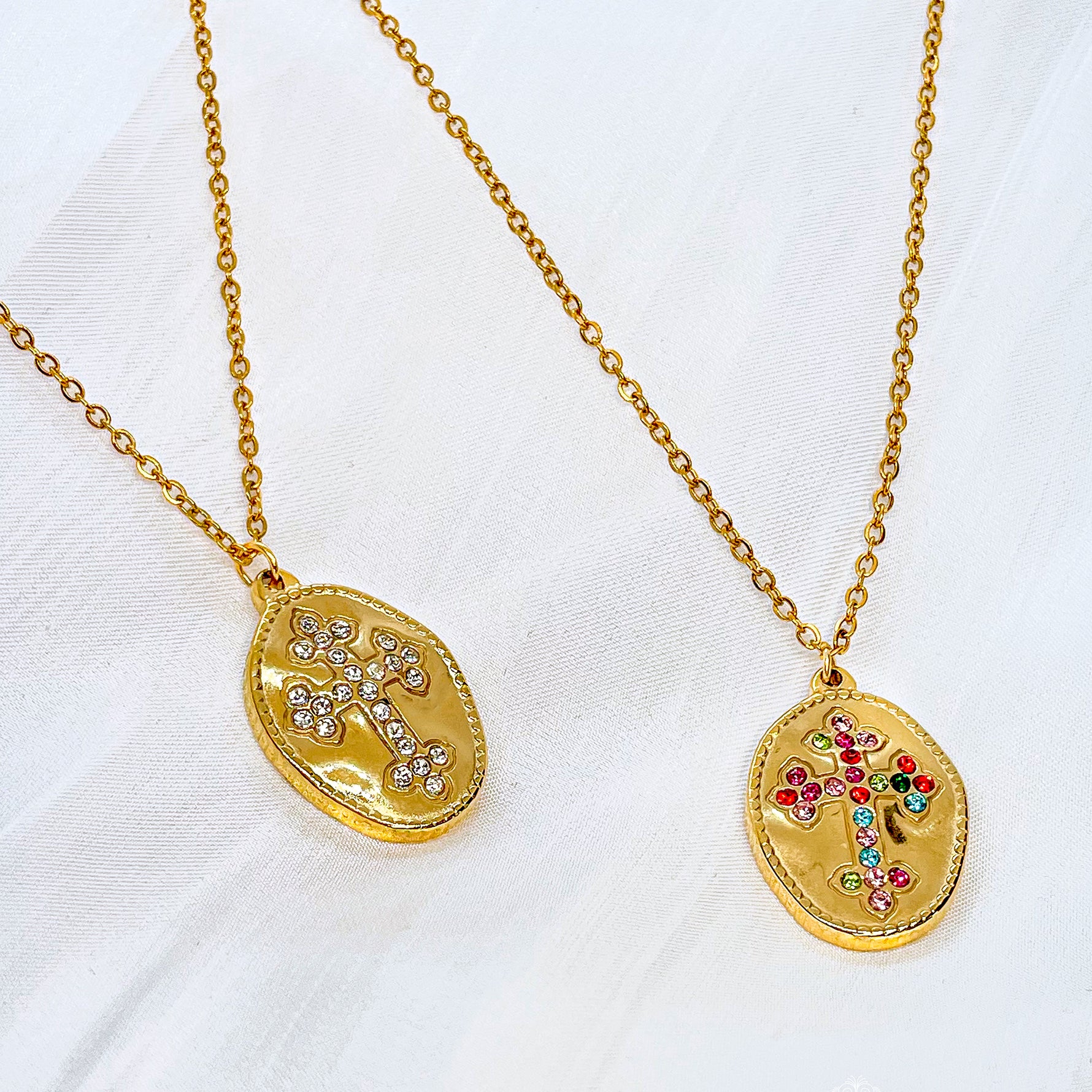 Two variations of the Celestia necklace: one featuring clear cubic zirconia stones, the other with colorful gemstones, displayed side-by-side.
