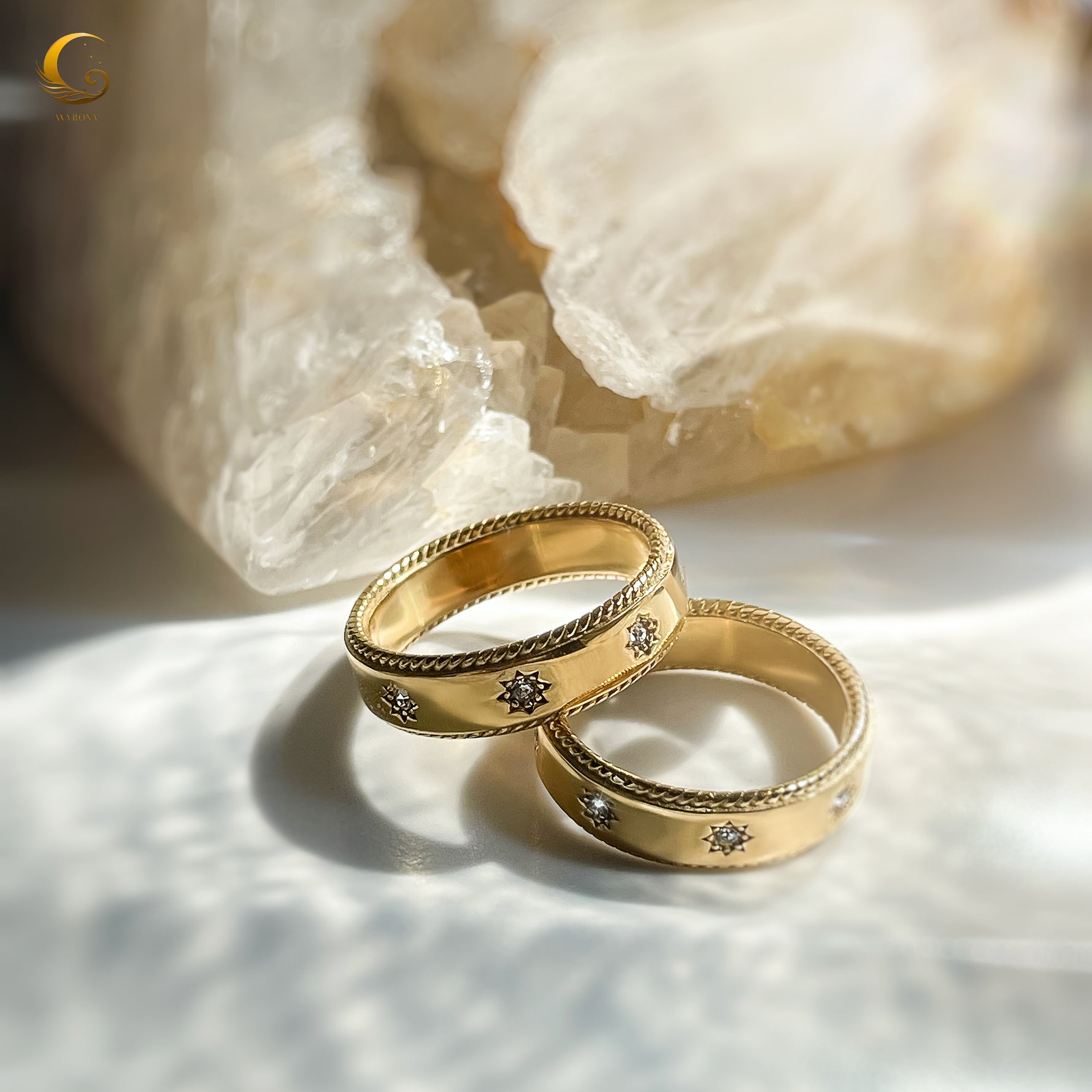 Artistic photo of gold star rings in soft lighting