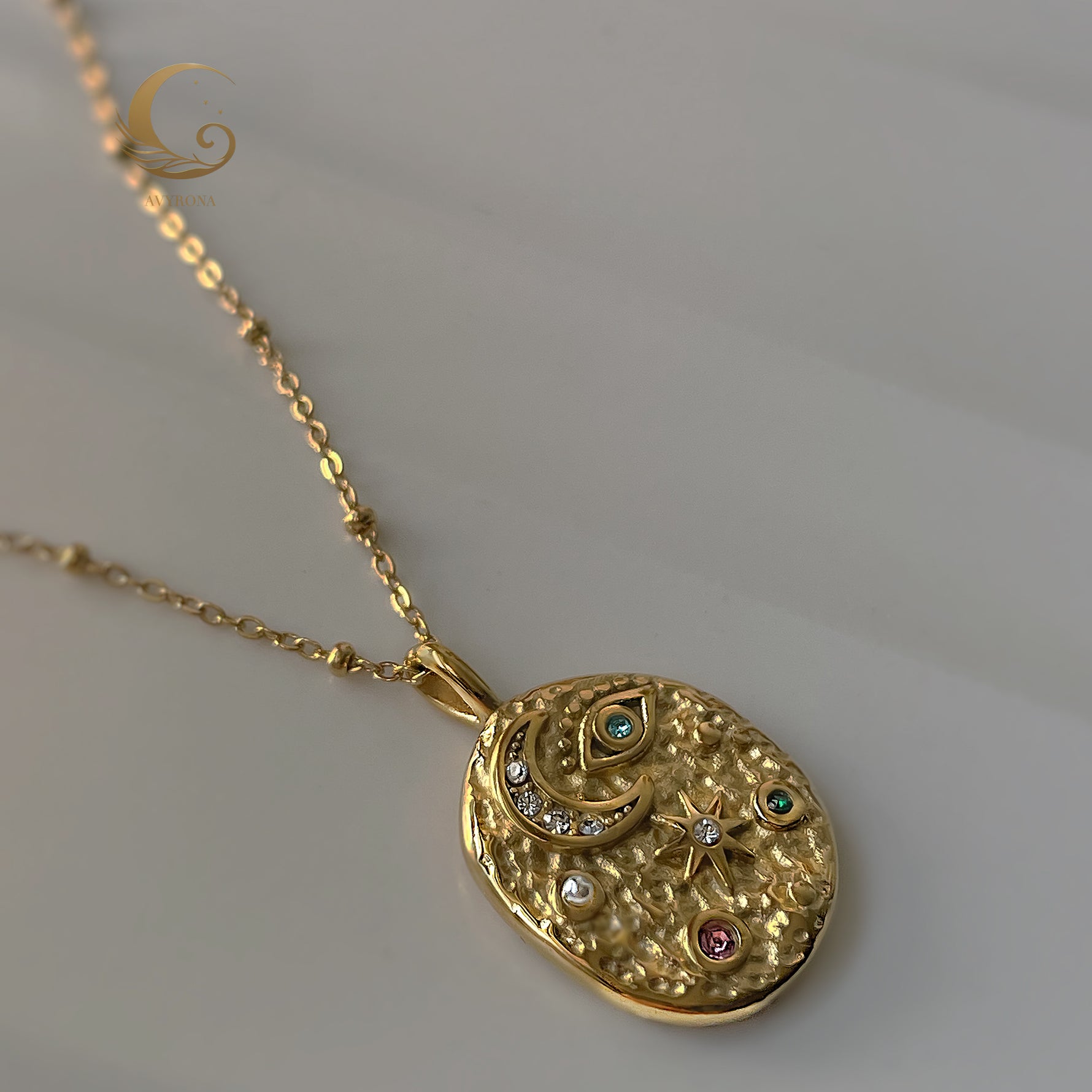 Side angle of Elara necklace showing delicate satellite chain and celestial design