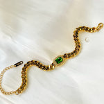 Harper Bracelet displayed in an S-shape with visible clasp and extension chain on white satin background.