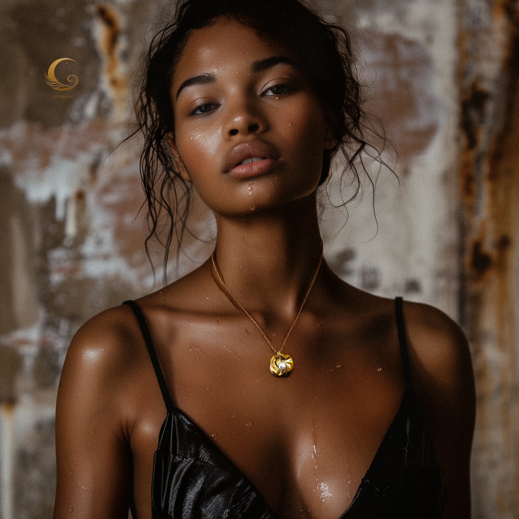 Model wearing Nymira necklace, water-kissed skin and elegant styling