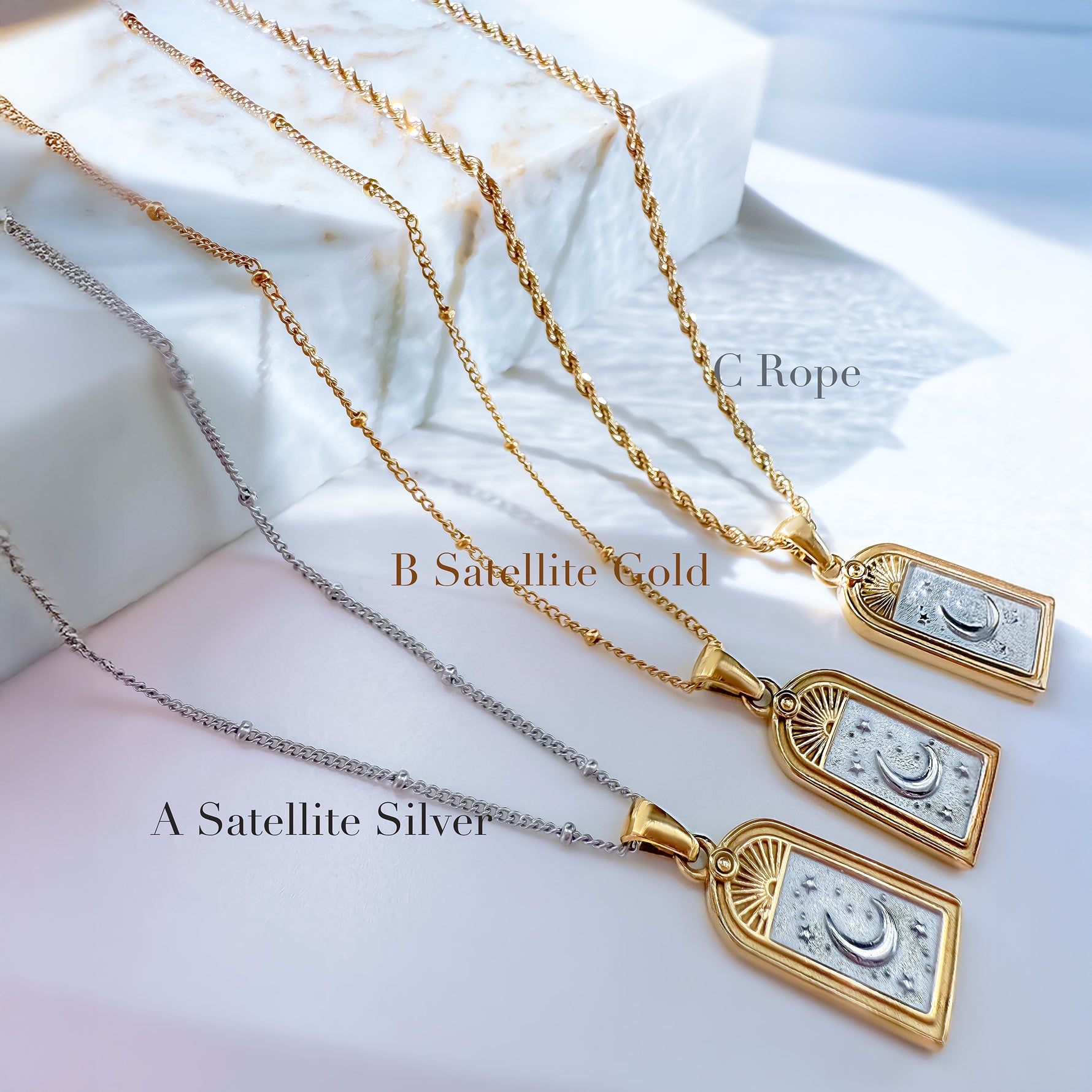 Selara tarot moon necklaces displayed with three chain options — A silver satellite, B gold satellite, and C gold rope chain, handcrafted 18K gold plated stainless steel jewelry by Avyrona.