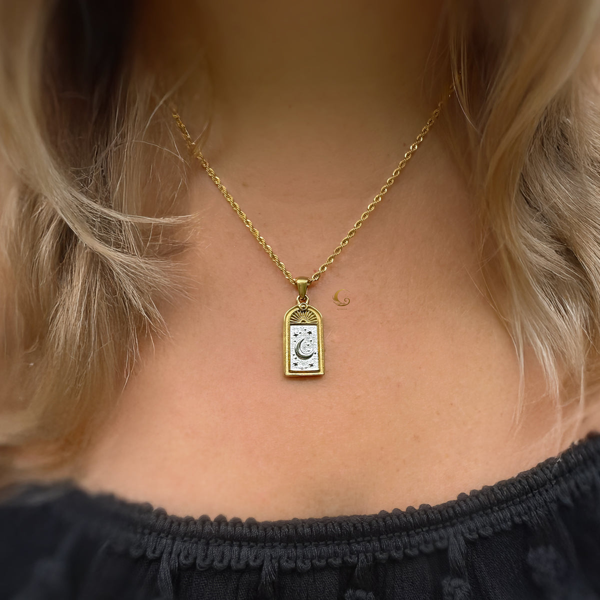 Selara tarot moon necklace in 18K gold plated 316L stainless steel worn on model — celestial pendant with crescent moon and star engraving by Avyrona.
