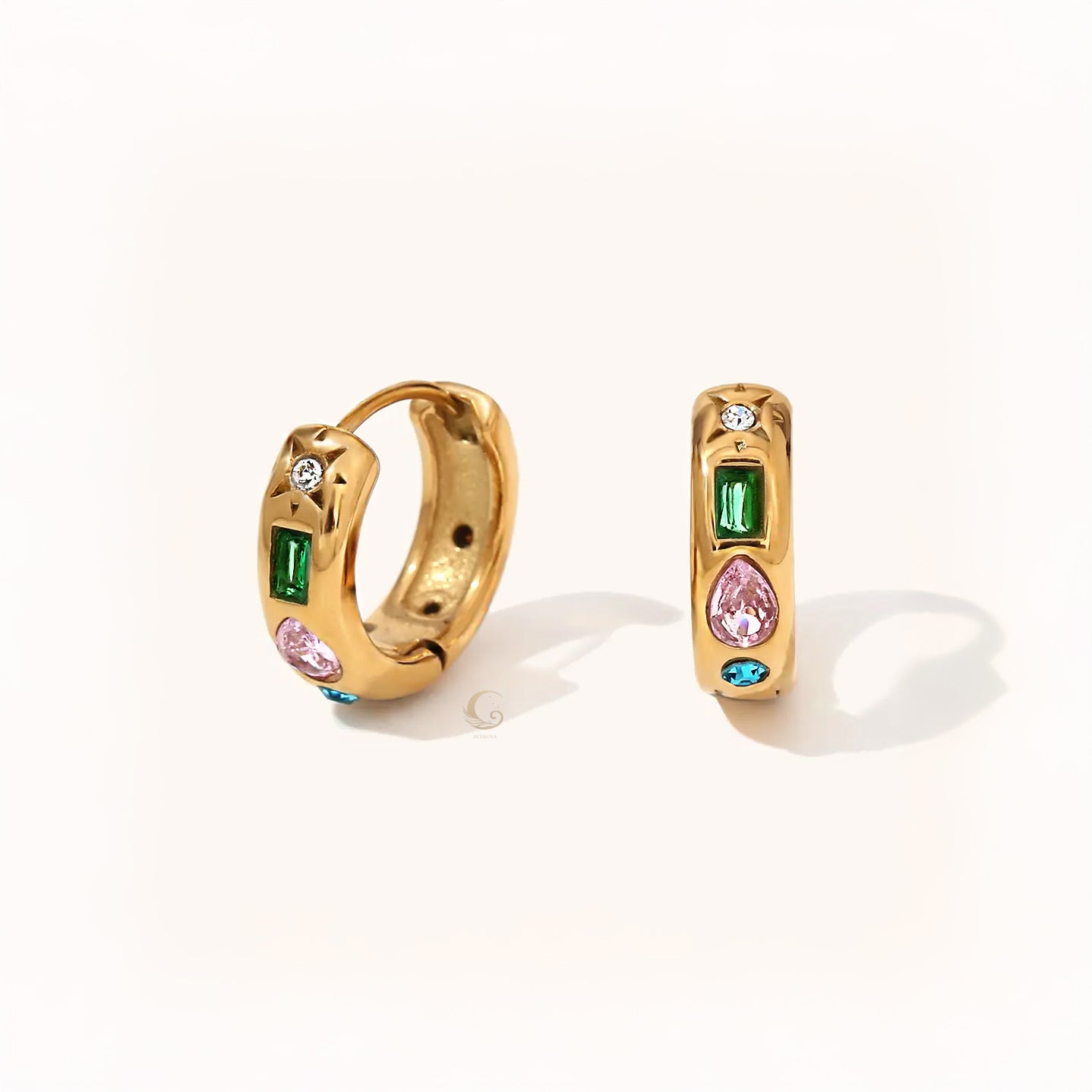 Pair of gold hoop earrings with baguette green, pear pink, round white, and blue stones arranged in a vertical line.