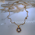  Full view of Vega necklace with clasp and extender visible, displayed on a soft neutral surface