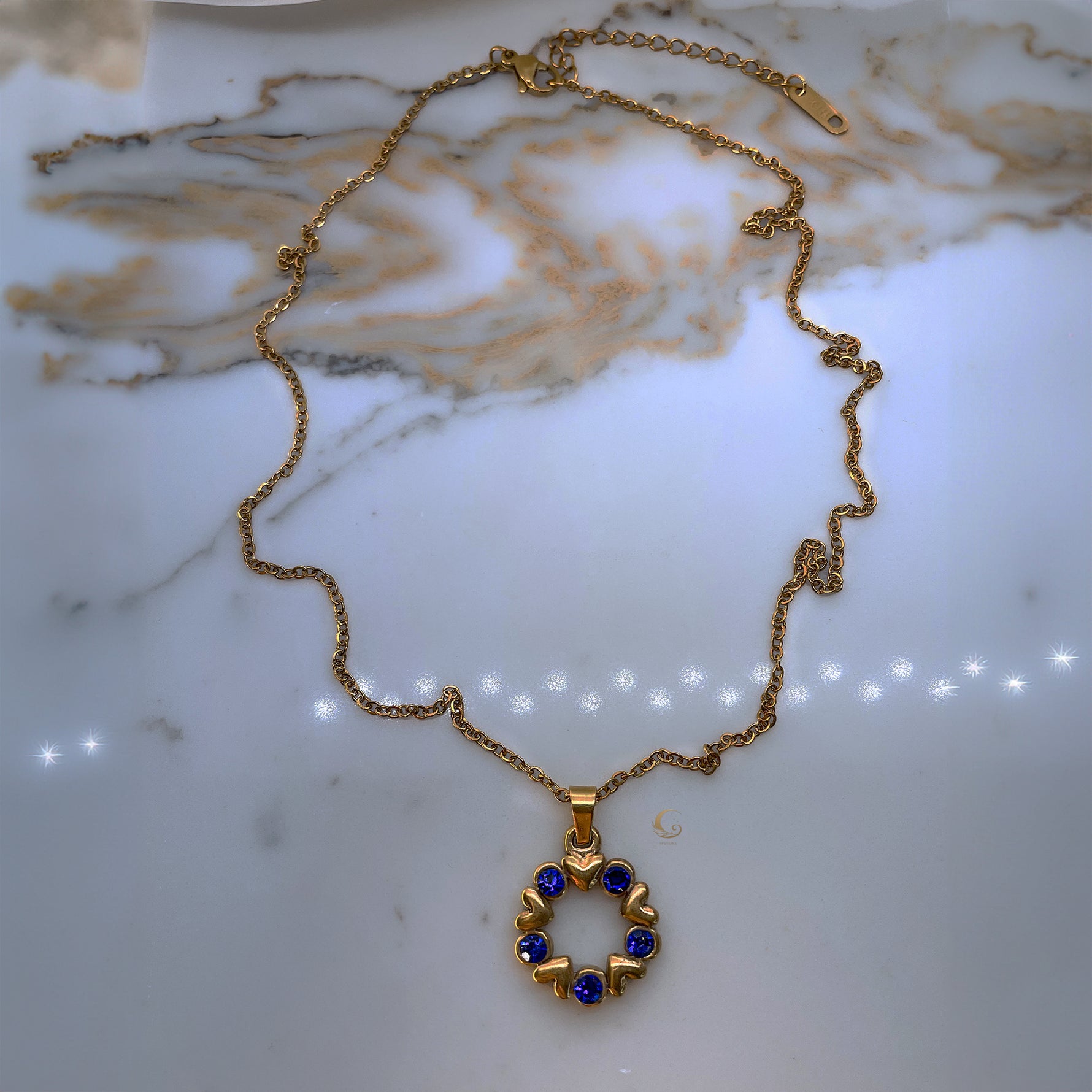  Full view of Vega necklace with clasp and extender visible, displayed on a soft neutral surface