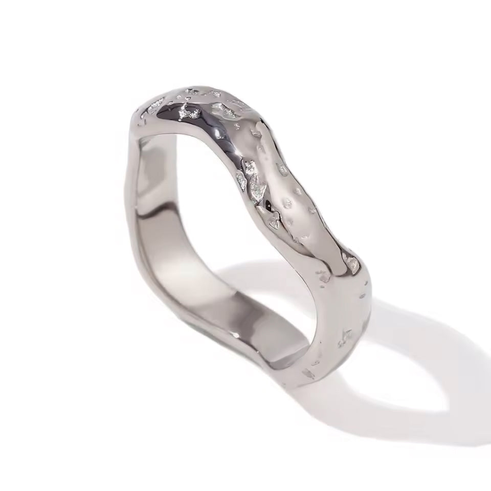 Solo view of the Wave ring in high-polish silver, showing its fluid, wave-inspired design.