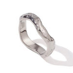 Solo view of the Wave ring in high-polish silver, showing its fluid, wave-inspired design.
