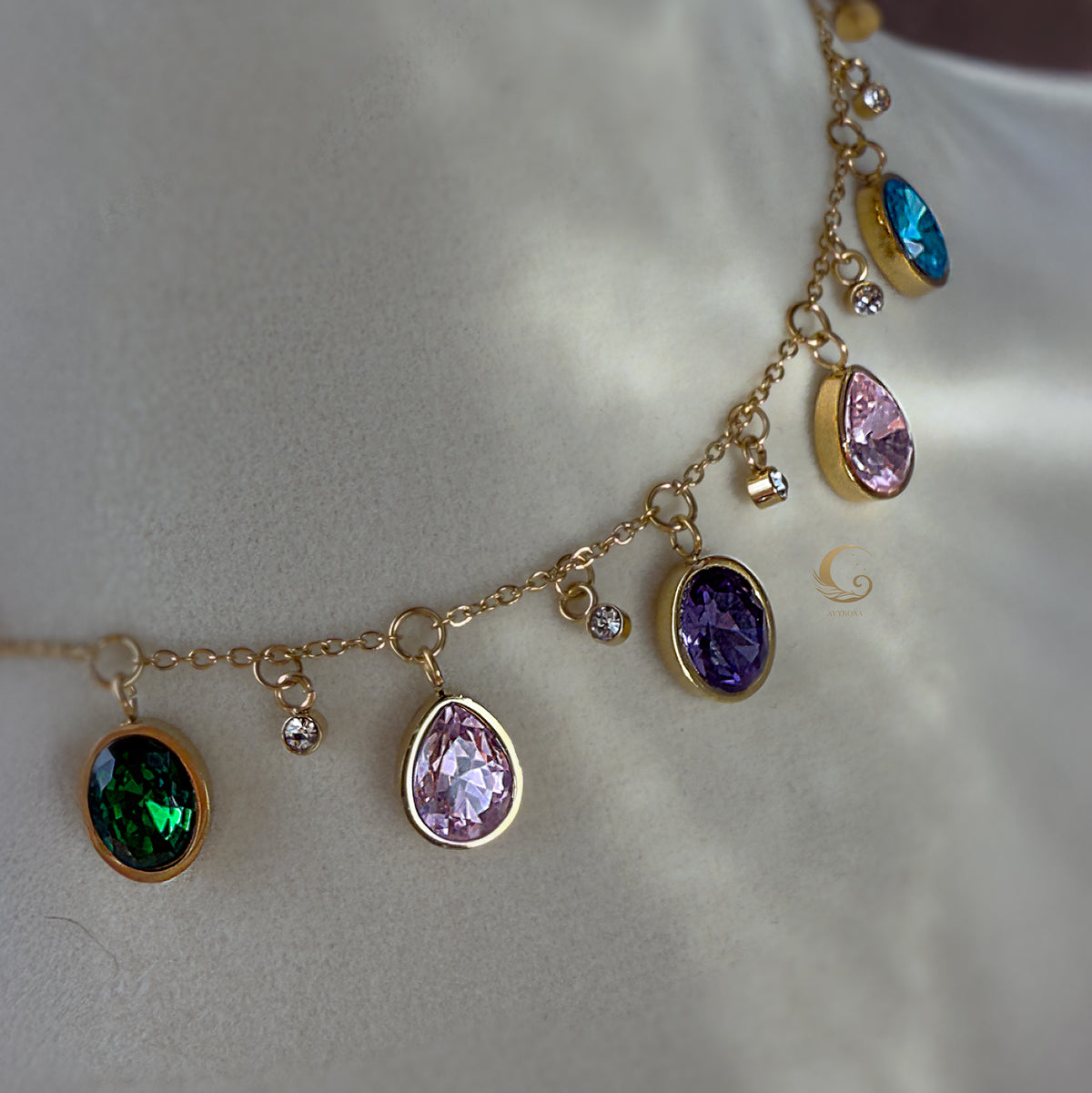 Close-up of dangling crystal charms on Zaria necklace, shown on bust