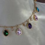 Close-up of dangling crystal charms on Zaria necklace, shown on bust
