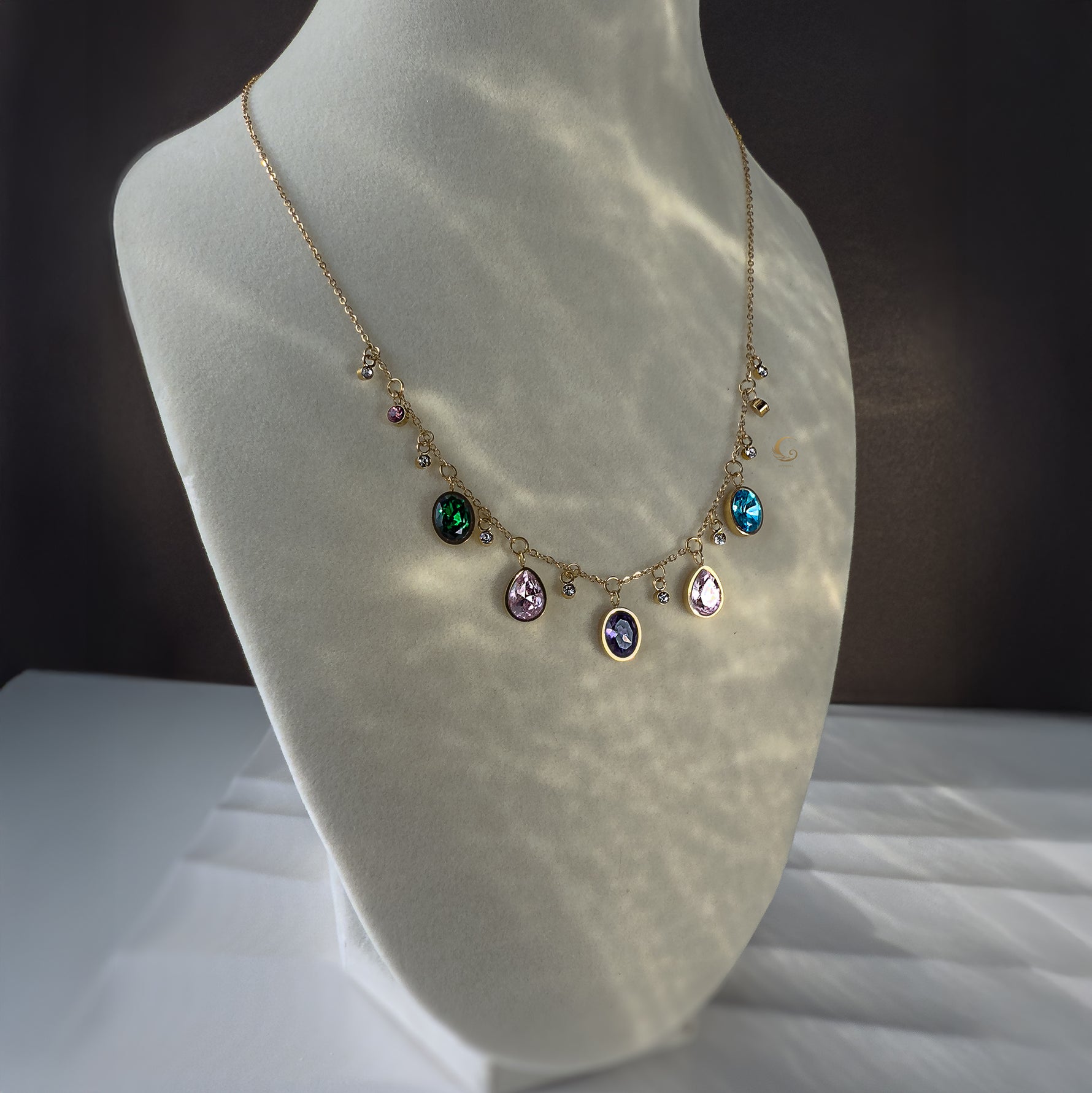  Zaria necklace glowing under soft light, displayed on mannequin